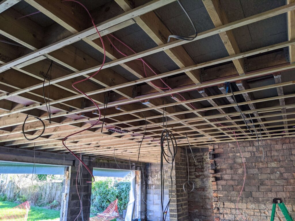 Pink speaker cabling ready for plaster boarding followed by the speaker install. Smart Home Installation Bristol & South West from LAVA